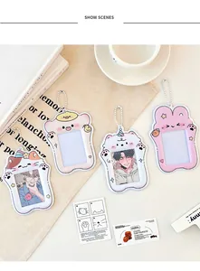 Close-up of cute cartoon PVC photocard holders with bead chains and clear windows