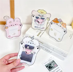 Close-up of cute acrylic animal card holders with transparent stands and cartoon designs