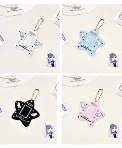 Detailed view of colorful star-shaped card holders with angel wing patterns and bead chains