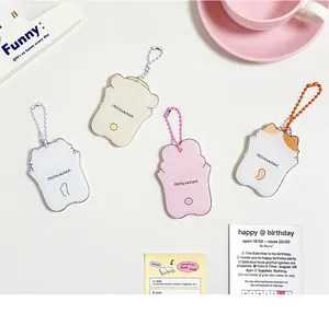 Flat lay of cute cartoon animal acrylic photocard holders with colorful bead chains