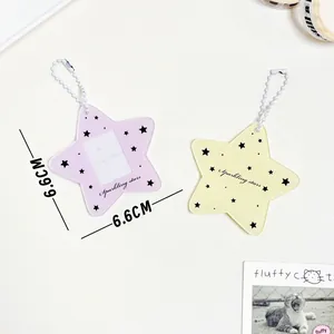 Star-shaped acrylic photo card holder in pink and yellow with sparkling star prints