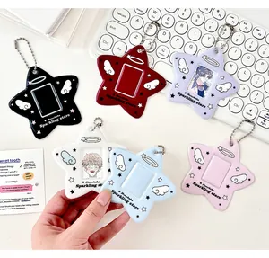 Detailed macro view of colorful star-shaped photocard holders with angel wing designs