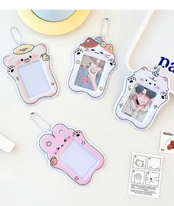 Flat lay of four unique cartoon animal PVC photocard holders with silver bead chains