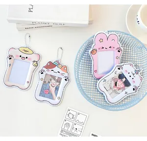 Close-up of cute cartoon animal PVC card holders with transparent windows and ball chains