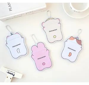 Detailed view of four colorful cartoon PVC card holders with metal ball chains