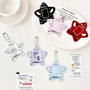 Star-shaped photocard holders with angel wings in various colors and silver ball chains