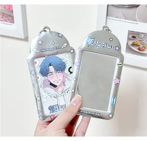 Close-up of shiny silver PVC photocard holders with colorful stars and metal ball chains