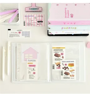 Close-up of transparent binder photocard holder with inner pockets and metal rings
