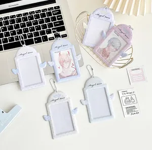 Detail of angel wing PVC photocard holder with metal bead chain in pastel colors