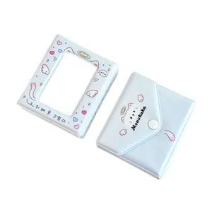 Light blue cat and angel wing photocard binder album with button closure and clear window