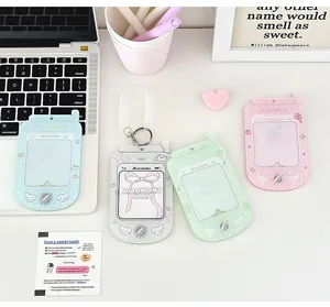 Flat lay of colorful vintage flip-phone style acrylic photo card holders with lanyards