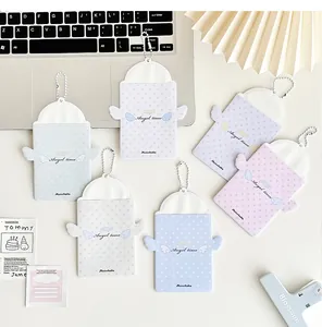 Detailed view of pastel angel wing photocard holders with metal bead chains in six colors