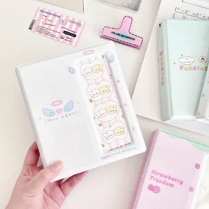 White 4-pocket photocard binder with angel wings design for kpop idol card storage