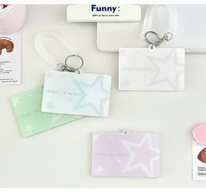 Macro detail of macaron acrylic ID card holders with star patterns and spiral wristbands
