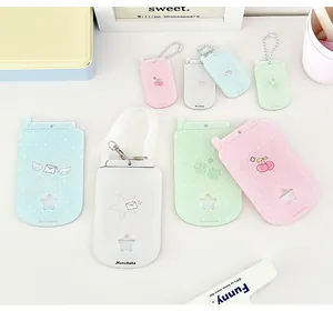 Macro shot of colorful retro phone style acrylic card holders with cherry and star motifs