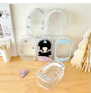 Transparent PVC storage bags with cute prints and dolls displayed on a wooden desk