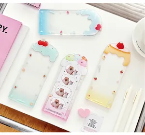 Flat lay of colorful acrylic card sleeves in macaron tones for photocard protection