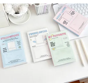 Detail of four soft cover planners with transparent card slots in blue, pink, and green