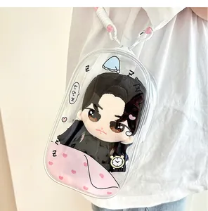 Detailed view of clear PVC plush doll display bag with pink heart pattern and strap