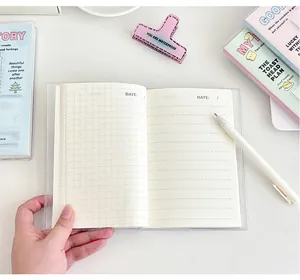 Detail of angel wing notebook with grid and lined pages and transparent waterproof cover
