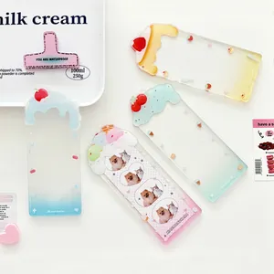 Transparent acrylic four-grid card holder with colorful cream drip designs and cute star motifs