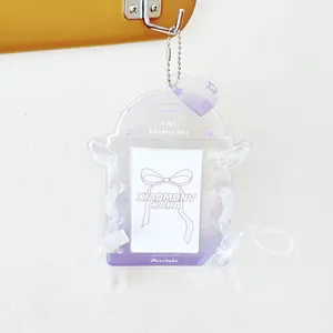 Glittery purple acrylic photocard holder with angel wings and white chiffon lace bows