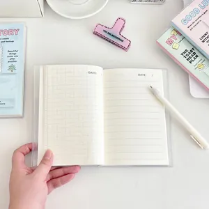 Minimalist angel wings notebook with grid and lined pages and clear protective cover