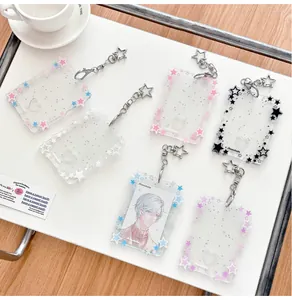 Macro detail of star-patterned glittery acrylic card holders with star-shaped metal clasps
