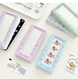 Vertical photo album for collectible cards featuring angel wings and a clear cover window