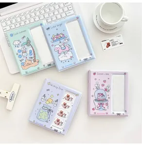 Close-up of cute cartoon k-pop photocard albums in four soft pastel macaron colors