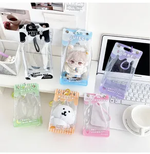 Detail view of transparent PVC doll display bags in drink box shapes with cute cartoon prints