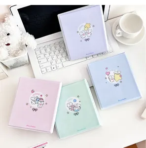Detailed view of colorful cartoon photo albums in pastel purple, blue, pink, and mint green