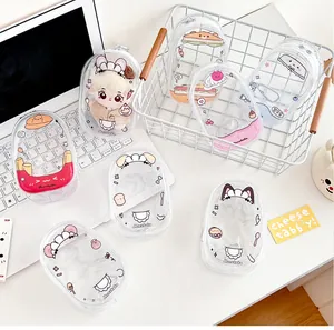 Macro detail of transparent PVC plush doll pouch featuring colorful cartoon designs