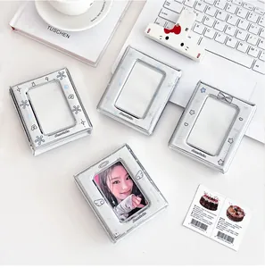 Close-up of four silver mini collect books with cute designs on a creative desk setup