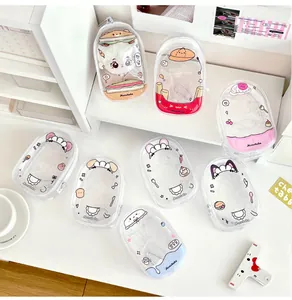 Close-up of clear PVC doll display bag with cute cartoon prints and metal clip hook