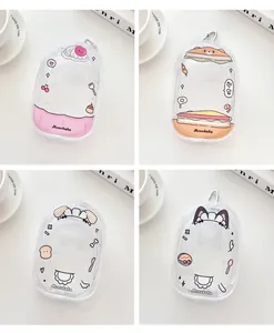 Macro view of four various transparent PVC snack-themed mini pouches with metal hooks