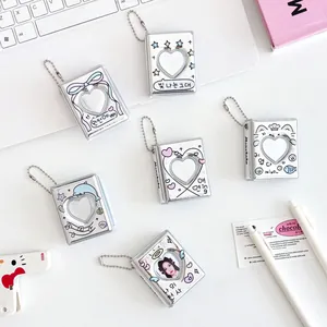 Mini silver heart cutout photo albums with Korean-style illustrations and bead chains