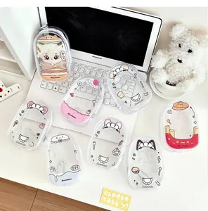 Detailed view of colorful PVC doll storage pouches with cute cartoon prints and metal hooks