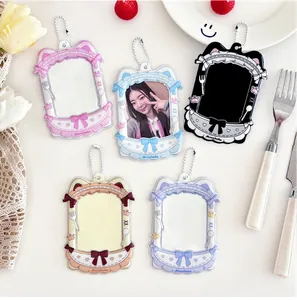 Detail of five cat-ear shaped acrylic photocard holders with colorful lace and bow patterns