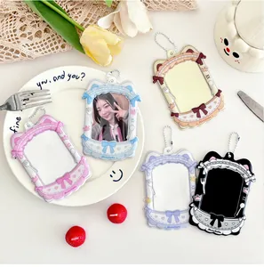 Detailed view of five colorful cat-ear PVC card holders with lace and bow decorations