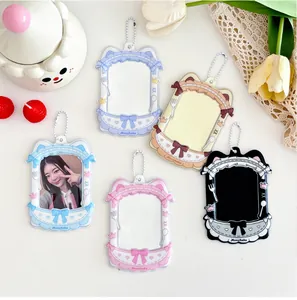 Detailed close-up of cute cat-ear PVC card holders with lace edges and bead chains