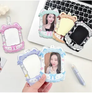 Close-up of cute cat-ear acrylic photo card holders with colorful heart patterns
