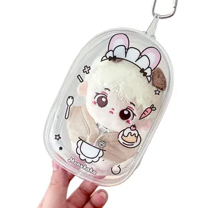 Plush doll with blonde hair in a transparent PVC capsule carry case with rabbit prints