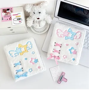 Detail of A6 plush photo card binder showing delicate star embroidery and silk ribbon ties