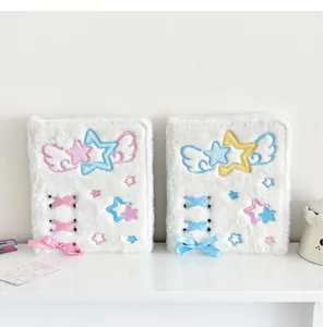 Detail of plush A6 binder featuring soft fur, star embroidery, and silk ribbon bow