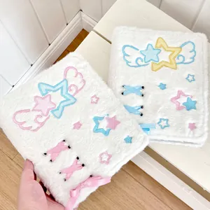 White plush A6 binder with star embroidery and ribbons in blue and yellow colorways