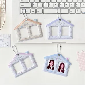 Macro detail of house-shaped double-slot photo card holders with silver bead chains