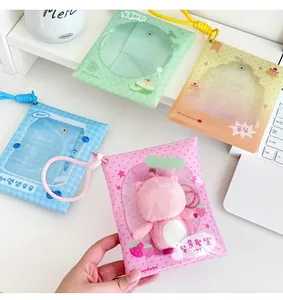 Detail of colorful clear PVC doll storage bags with checkered trim and lanyards