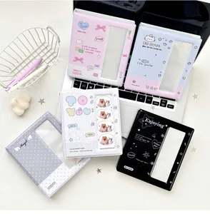 Detailed overhead view of five colorful polka dot mini photo albums for cards