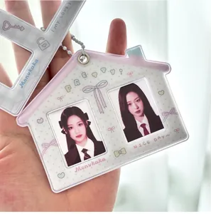Detail of house-shaped double-slot photo card holder with cute patterns and keychain